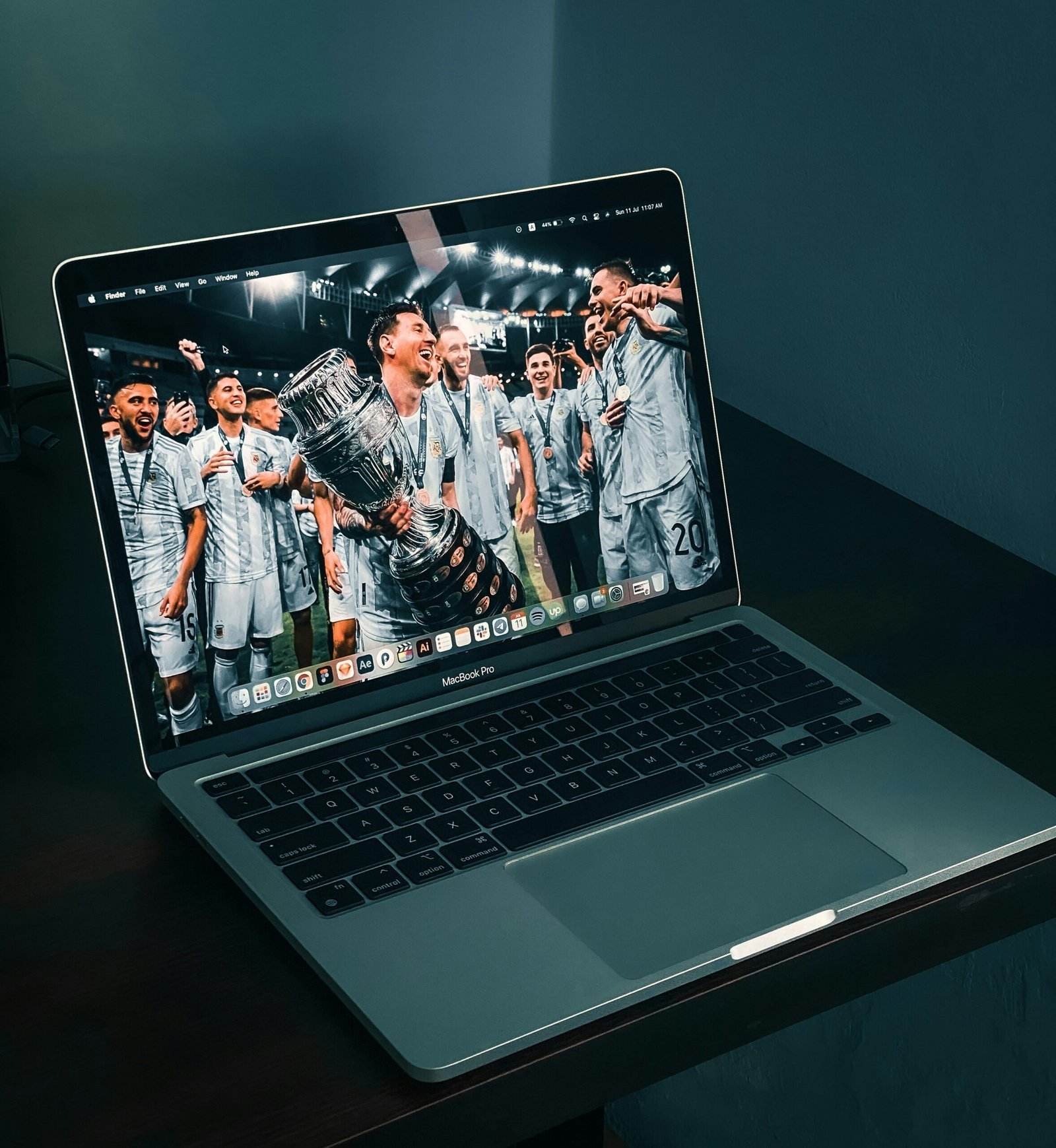 macbook pro on brown wooden table